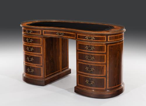 Early 19th century Regency rosewood and tulipwood banded kidney shaped desk
